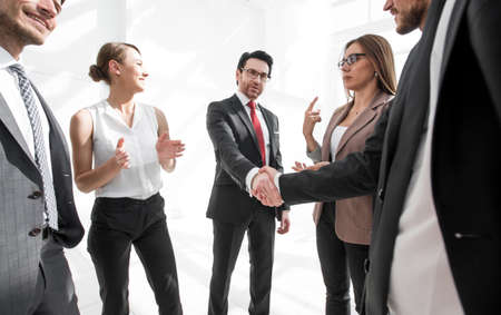 Business handshake in a modern office