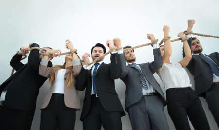 people pulling and connected with the concept of a ropeの写真素材