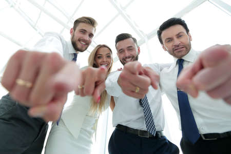 close up.smiling business team showing off at youの写真素材