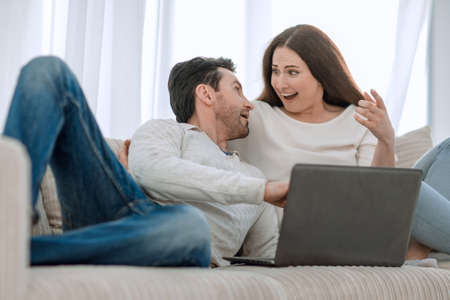 A young couple is rooting for their favourite team