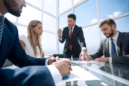 angry Manager scolds employees at a working meeting