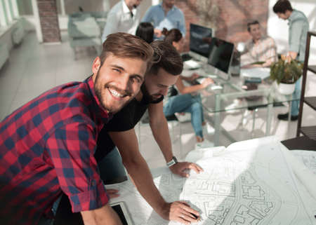 two architects discussing the sketches of a new projectの写真素材