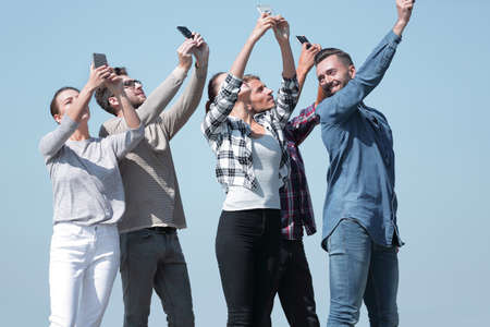 group of young people with smartphonesの写真素材