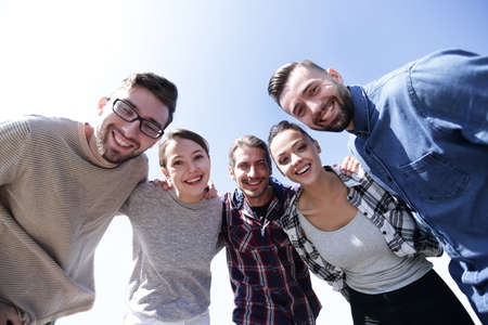bottom view.team of friends looking at the camera.の写真素材