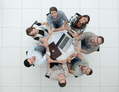 Business team people join hands forming circle