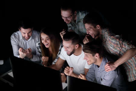 successful business team in the workplace at nightの写真素材