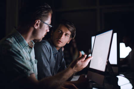 business team discussing current issues sitting at the Desの写真素材