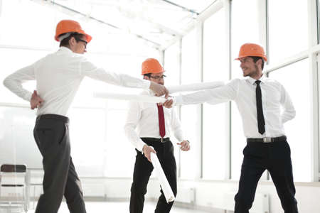 three architects struggle with curtailed construction plans