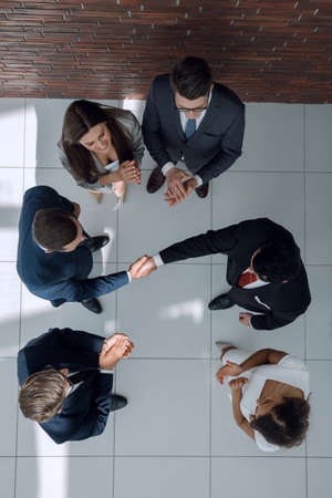 top view.business partners shaking handsの写真素材