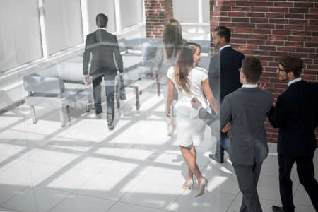 background image.group of employees, late for work