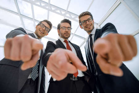 We choose you! three business men pointing at you