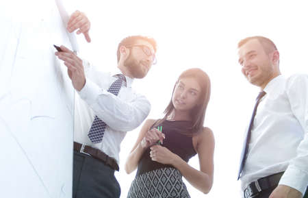 business team looking at a blank flipchart.の写真素材