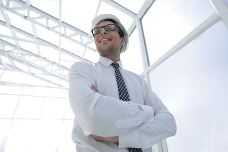 successful architect on the background of a bright officeの写真素材