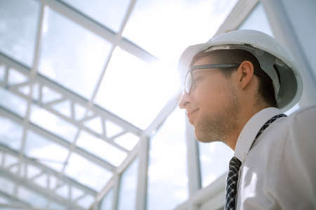 background image. young architect in an empty officeの写真素材