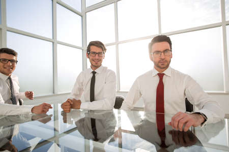 group of successful employees sitting at an office Deskの写真素材