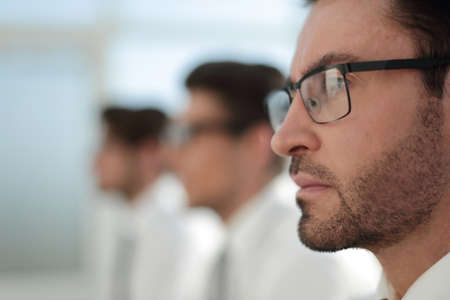 close up.businessman on the background of colleagues