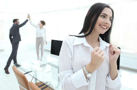 successful happy business woman sitting at the desk.の写真素材