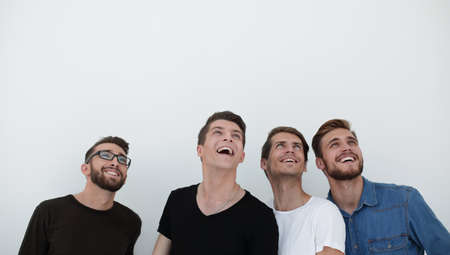 portrait of many men smiling and looking upwards