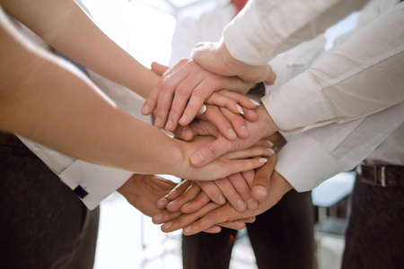 Stack of hands - real people agreement