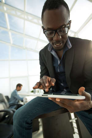 close up.modern young businessman using a digital tablet.