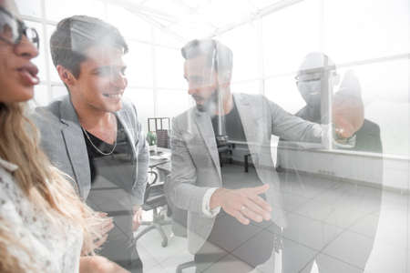 close up.businessman discussing with employees his new ideasの写真素材