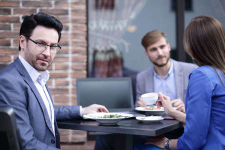 modern businessman on the background of the cafeの写真素材