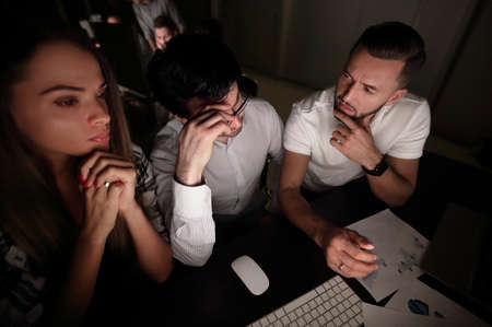 business team sitting at the Desk.