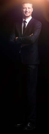 full growth. portrait of a confident smiling businessmanの写真素材