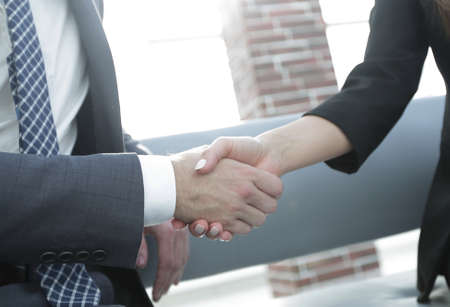 Businessman shaking hands to seal a deal with his partnerの写真素材