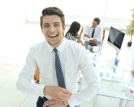 successful businessman on background of office.