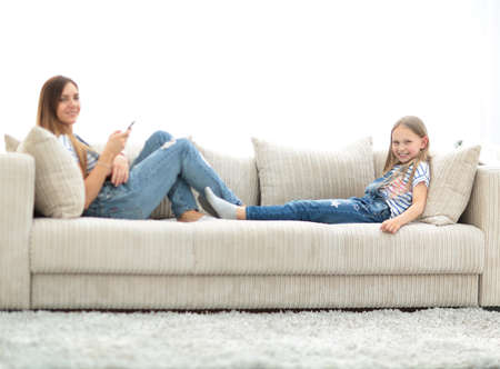little girl jumping on the couch on the couch in the living room