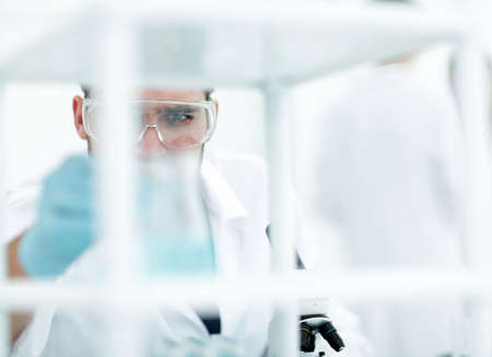 closeup.male chemist on blurred background laboratoryの写真素材