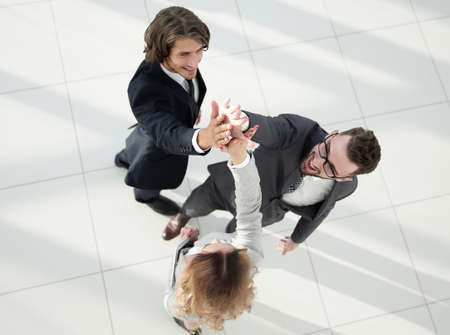 Business people giving high five staying in the officeの写真素材