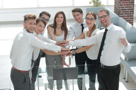 smiling business team showing their unity