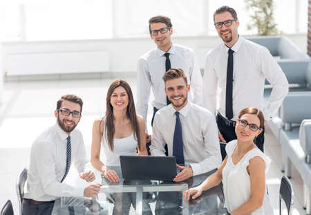 smiling business team at the workplace in the officeの写真素材