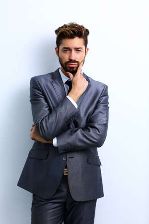 young businessman posing with crossed arms.の写真素材