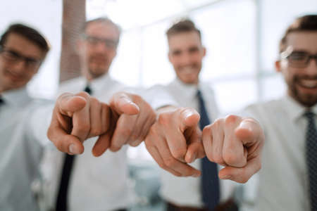 background image of a successful business team pointing to youの写真素材