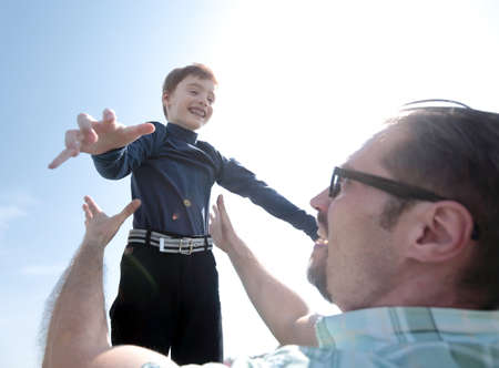 happy father and son playing together.the concept of fatherhood