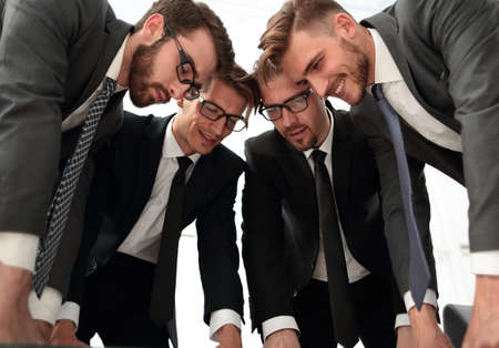 close up.a group of business people studying the terms of the contracの写真素材