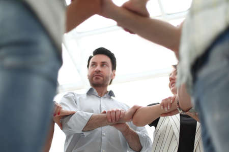 boss and the business team form a circle of hands