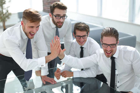 employees giving each other a high five