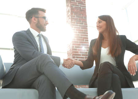 Businessman shaking hands to seal a deal with his partnerの写真素材