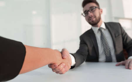 Successful businessmen handshaking after good deal.