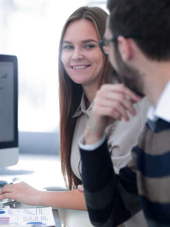 business colleagues discussing financial chartsの写真素材