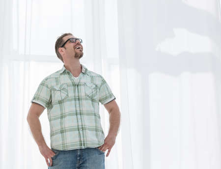 modern man looks away at a copy of the space