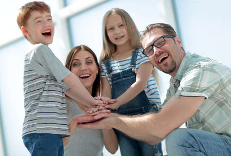 happy family laid down their tower from their hands