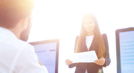 business colleagues discussing documents in the office.の写真素材