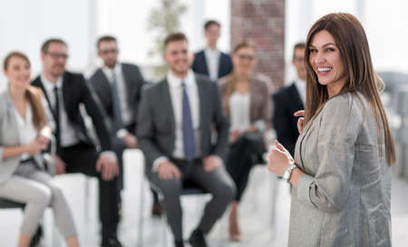 young business woman standing in conference roomの写真素材