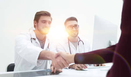 handshake of a doctor and his patientの写真素材