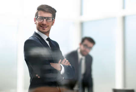 employee reads sticky-notes on glass.の写真素材